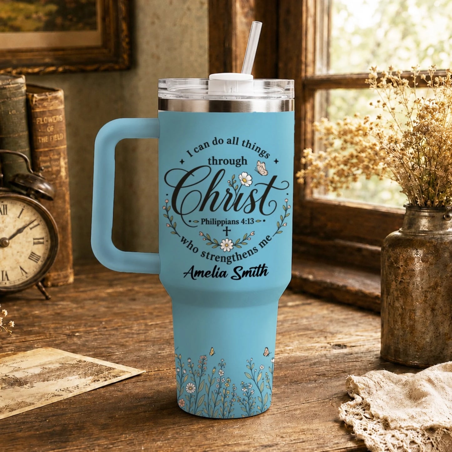 Light blue stainless steel tumbler featuring Philippians 4:13 verse, floral motifs, and a personalized name tag.