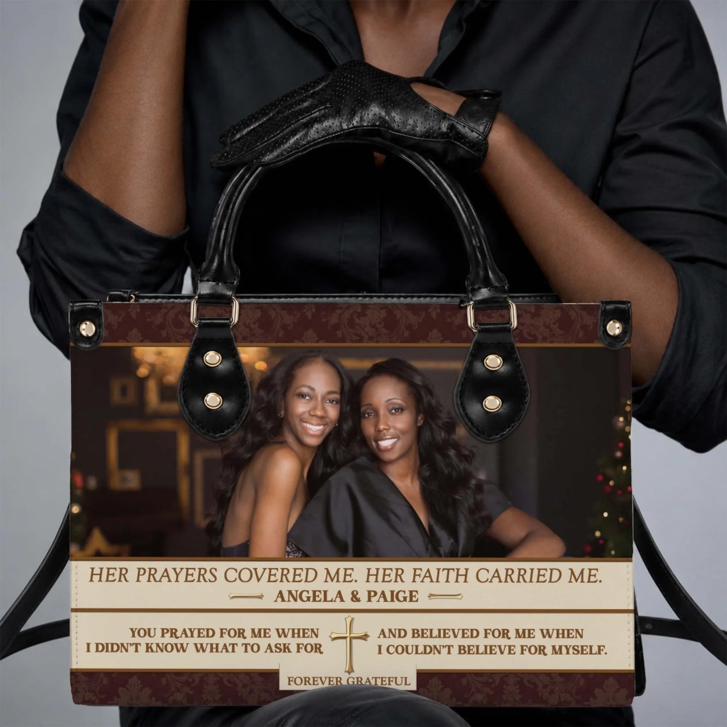 Woman holding a custom photo PU leather handbag featuring a heartfelt tribute message and religious cross design.