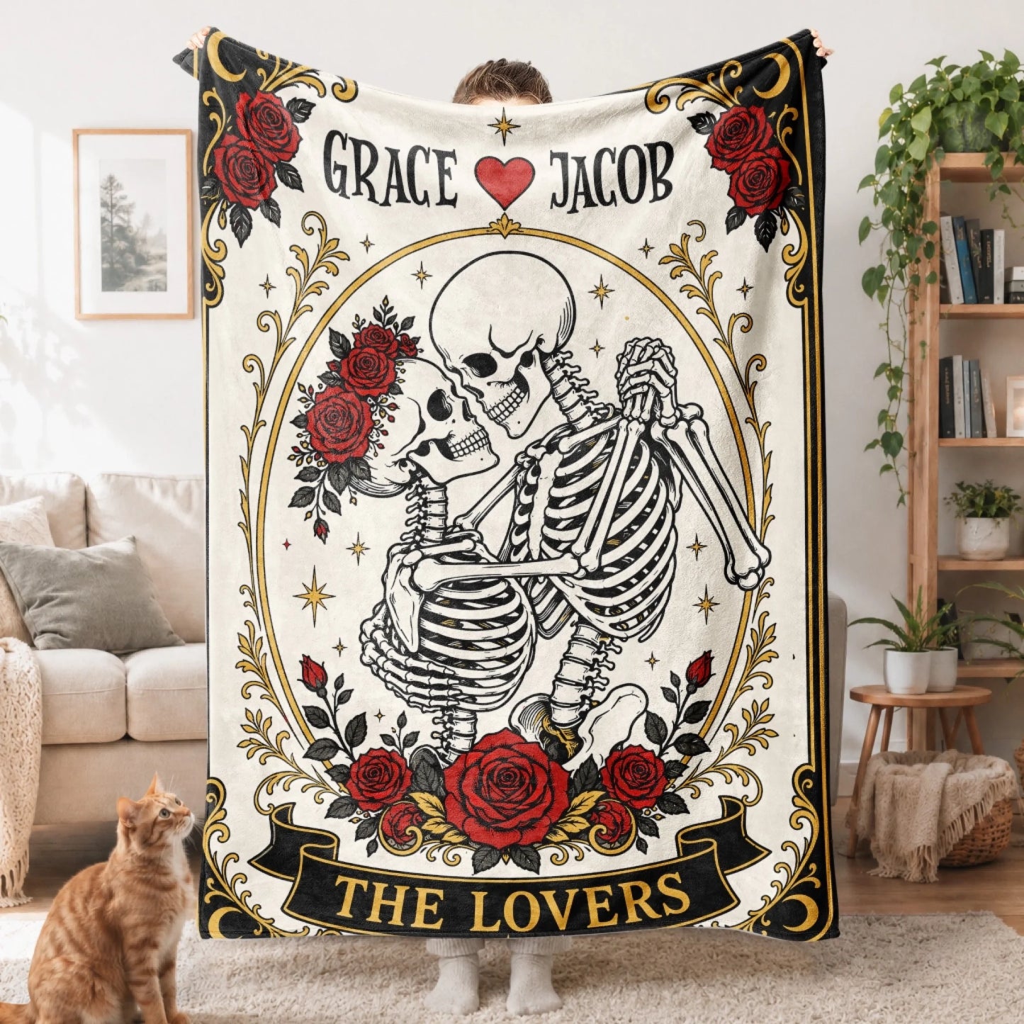 Gothic style tarot card fleece blanket displaying a skeleton couple with red flowers and custom Grace Jacob lettering.