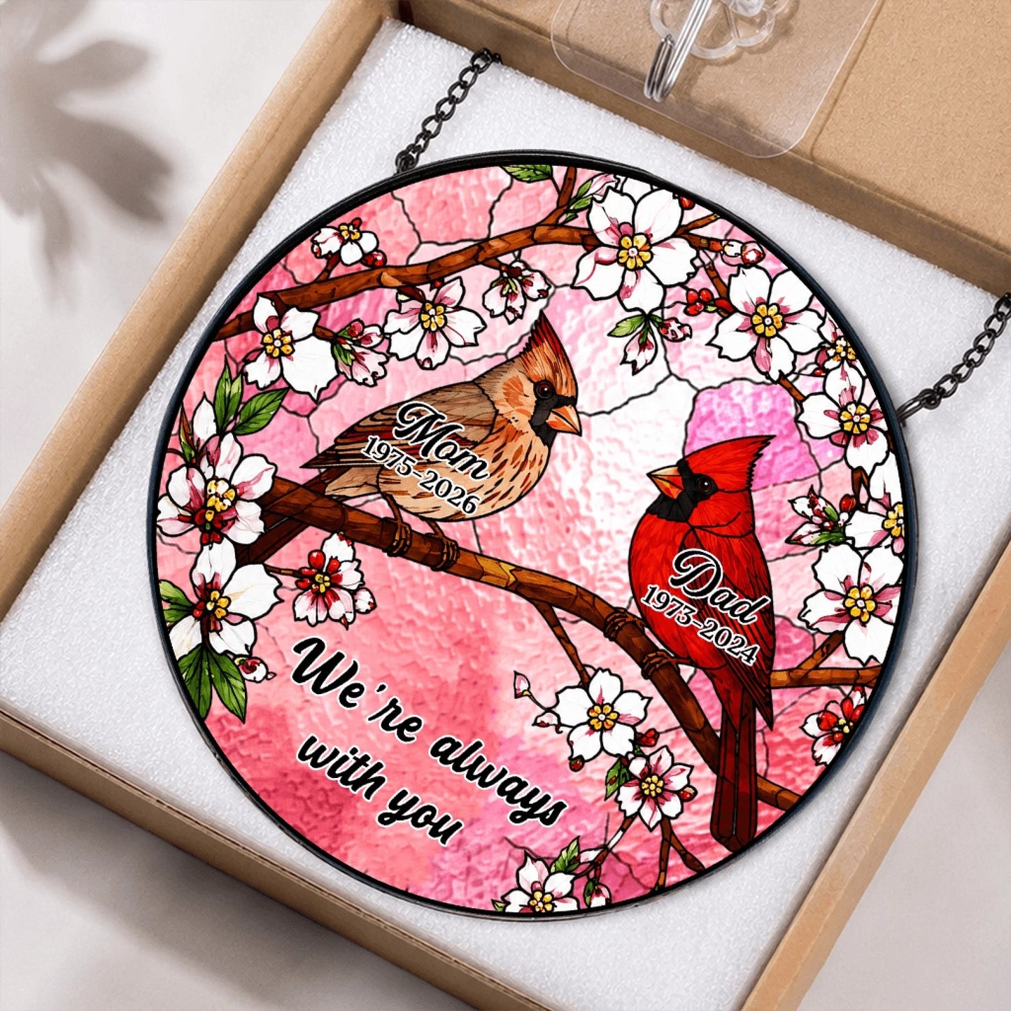 Customized memorial gift featuring cardinal art and names for parents packaged in a box for sympathy gifting.