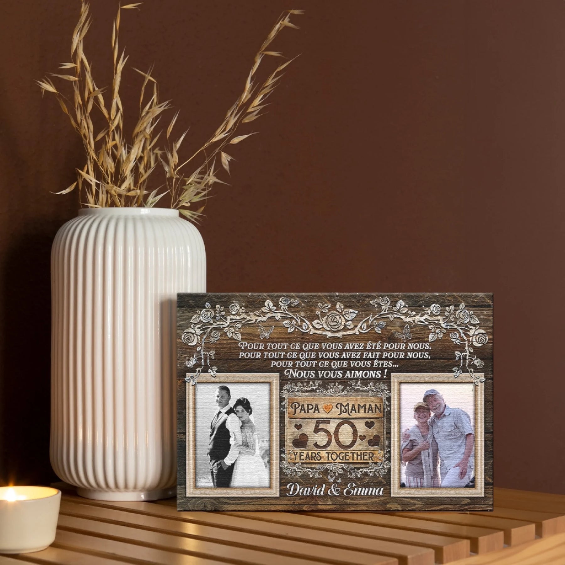 Personalized 50th anniversary canvas gift with couple photos and floral border displayed on a shelf