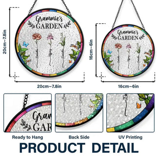 Decorative glass panel with 'Mama Garden' text and floral designs, hanging against a blurred greenery background.