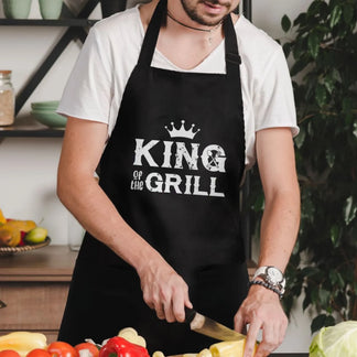 Personalized black apron with lets cook text and kitchen tools front view - Jollimate