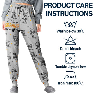Gray pajama pants with child illustrations and product care instructions on a white background