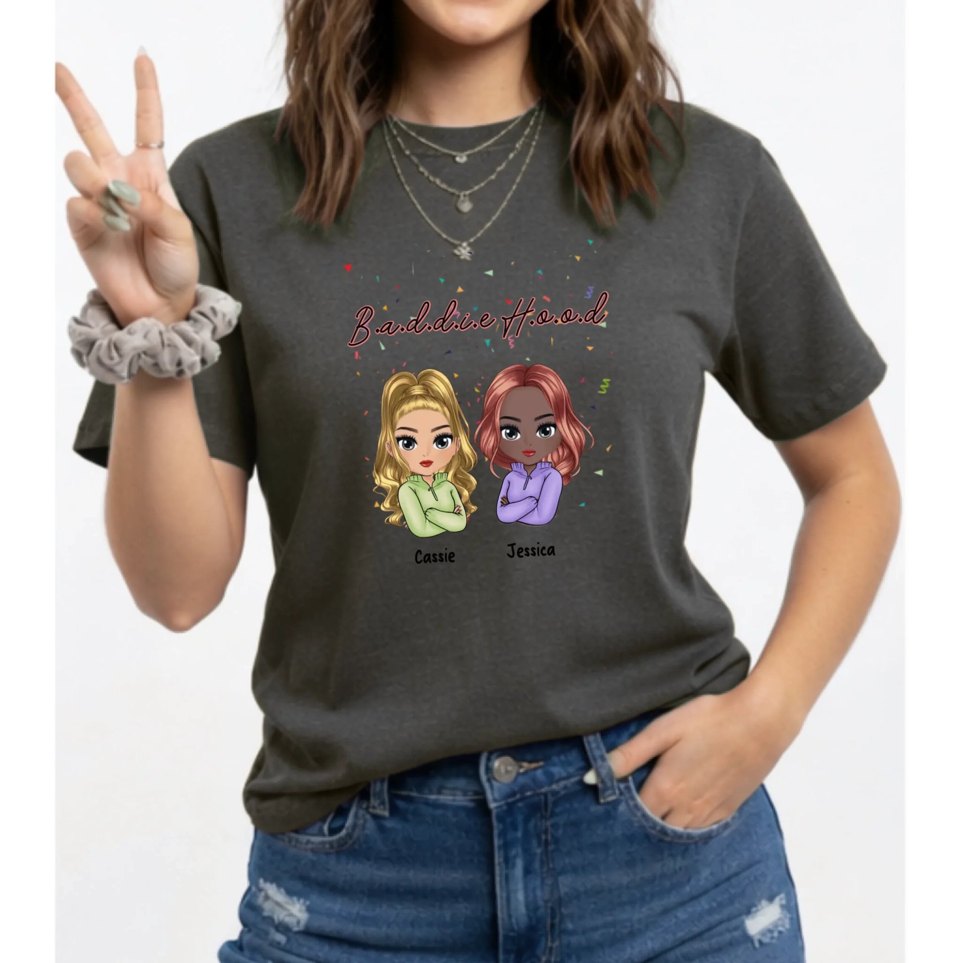 Person wearing a dark gray t-shirt with cartoon characters and text on a white background