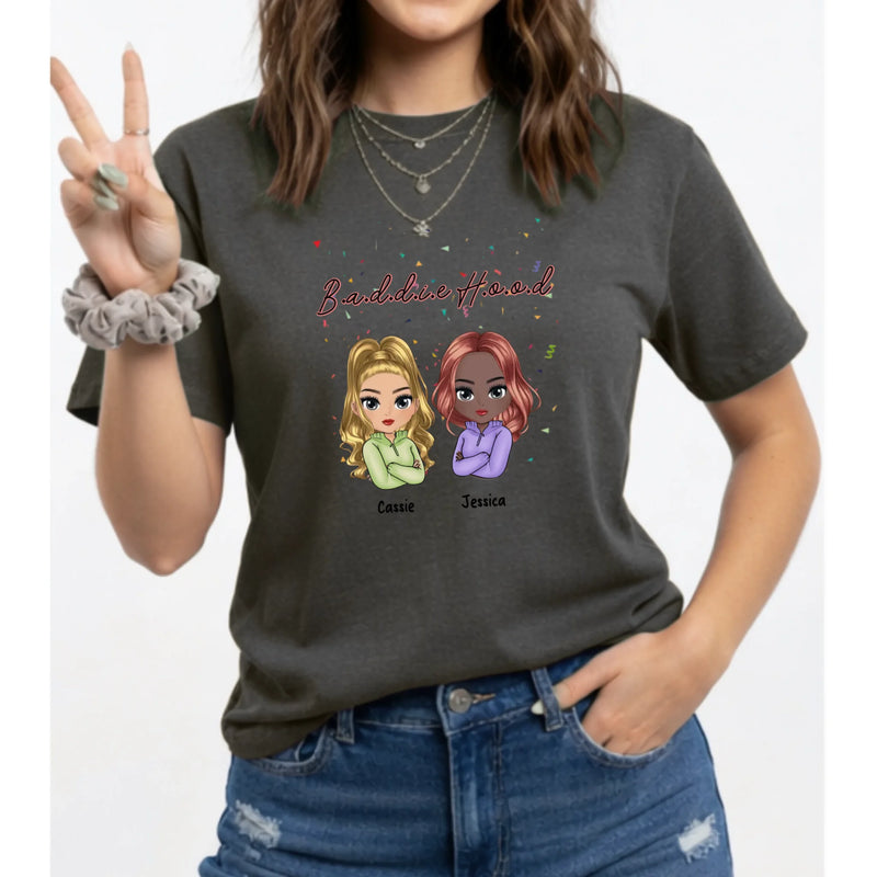 Person wearing a dark gray t-shirt with cartoon characters and text on a white background