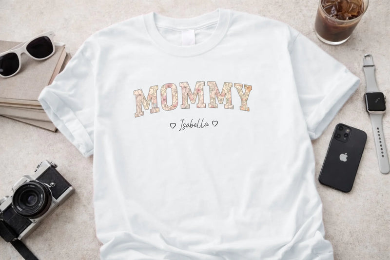 Personalized mommy t-shirt in white with floral block letters and custom names front view - Jollimate
