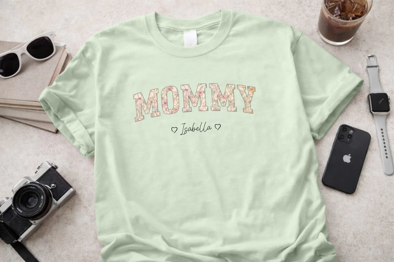 Personalized mommy t-shirt in bay with floral block letters and custom names front view - Jollimate