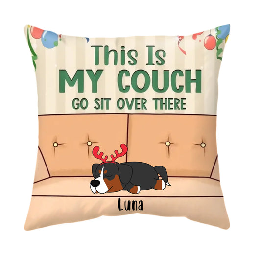Decorative pillow with a cartoon dog and text 'This is my couch go sit over there' on a beige background.