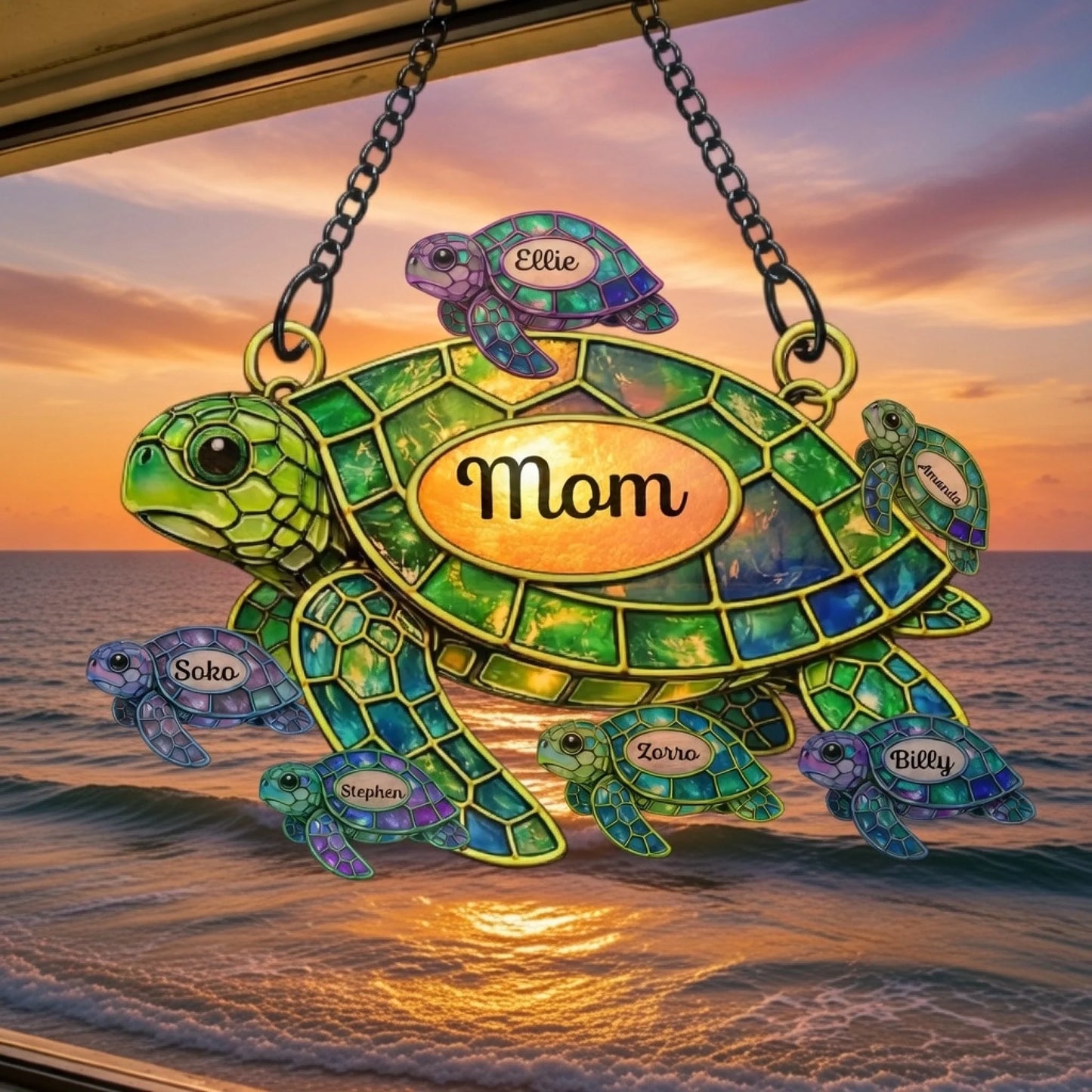 Decorative turtle ornament with 'Mom' on a sunset beach background