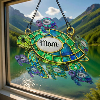 Decorative stained glass turtle with 'Mom' on a mountain lake background