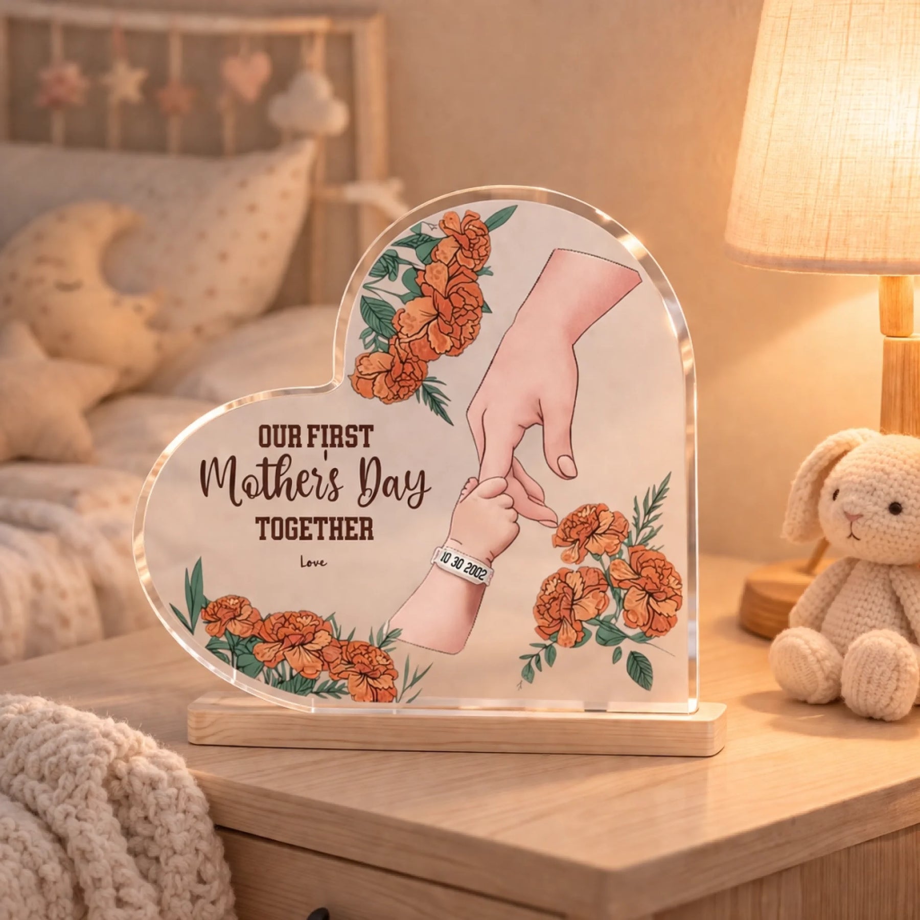 Personalized acrylic plaque with mother baby hands and floral design on bedside table warm nursery view - Jollimate