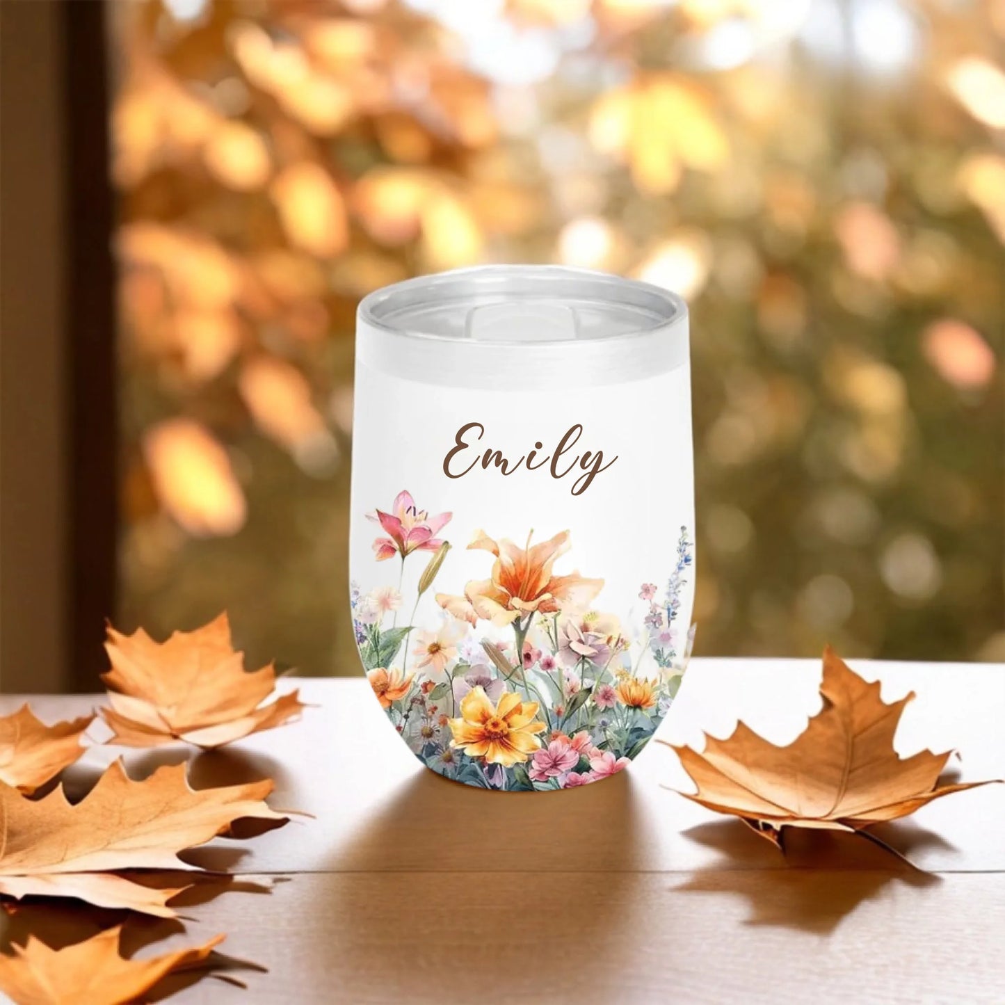 personalized floral tumbler with name emily fall background close up - Jollimate