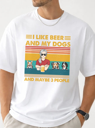 White t-shirt with graphic design featuring a person with dogs and text 'I like beer and my dogs and maybe 3 people' on a white background.