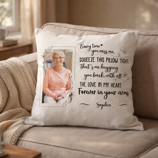 Personalized memorial pillow with photo and heartfelt message placed on beige sofa in cozy sunlit living room