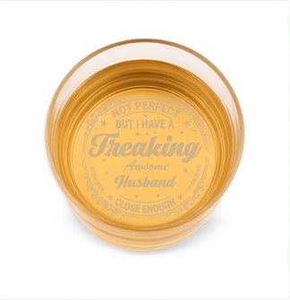 Glass coaster with text 'Not perfect but I have a freaking awesome husband' on a white background