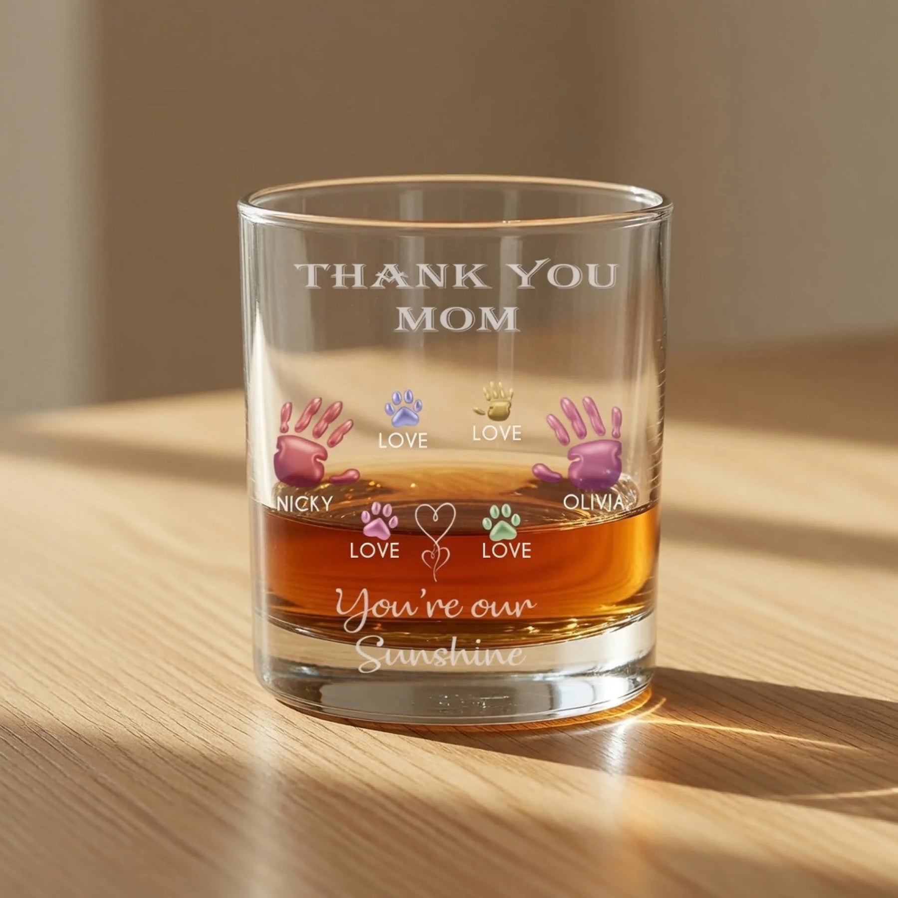 Personalized whiskey glass with thank you mom text and colorful family handprints front view - Jollimate