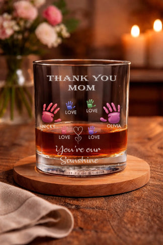 Personalized whiskey glass with thank you mom text and colorful family handprints front view - Jollimate