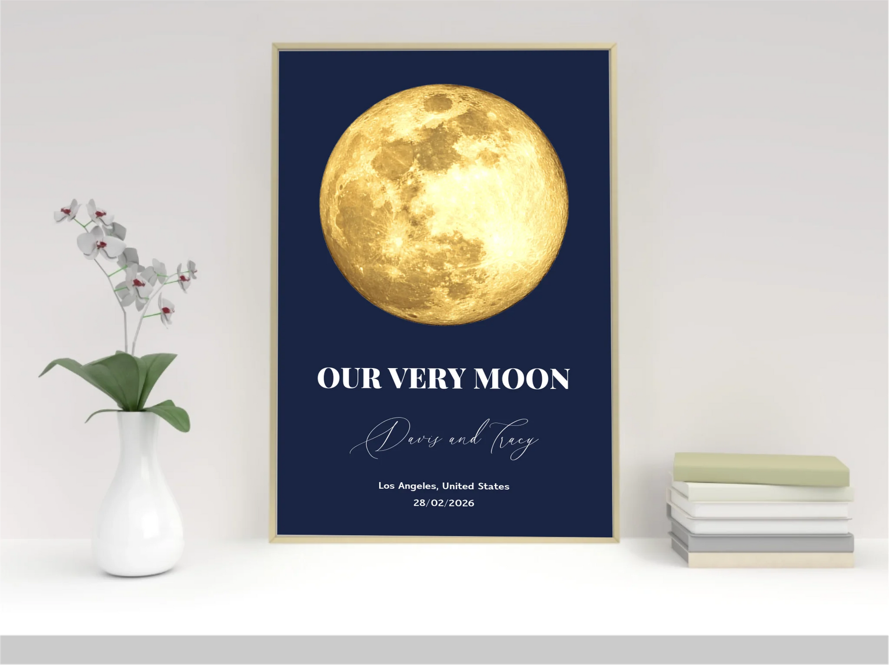 Framed print of a gold moon on a blue background with text.