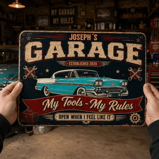A person's hands hold a vintage-style garage sign featuring a classic turquoise car, 'My Tools - My Rules' text, and a toolbox.