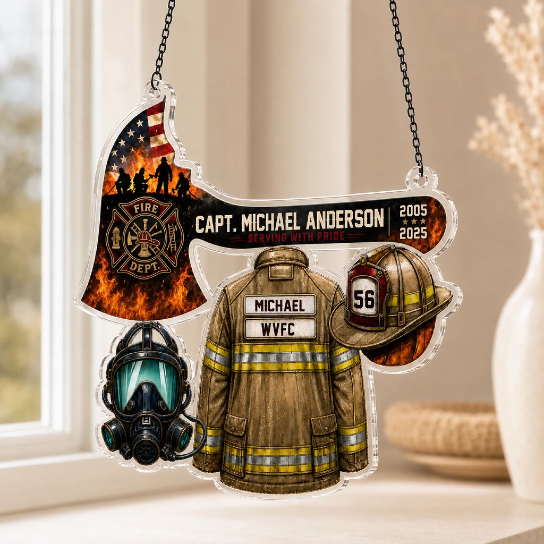 An acrylic hanging firefighter ornament shaped like an axe with an American flag, a jacket, helmet, and mask, in a home setting.