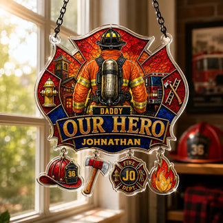 Decorative sign with firefighter design and 'Daddy Our Hero' text, hanging in a room with a window.
