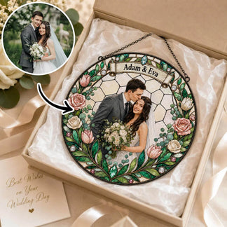 Personalized decorative plaque with a couple's photo and names, surrounded by flowers, in a gift box.