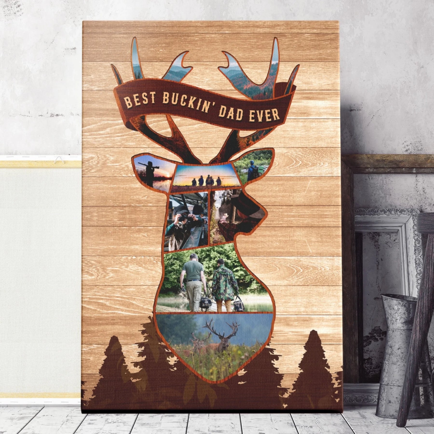 Vertical canvas print with a deer head silhouette collage of outdoor photos, a banner reading "BEST BUCKIN' DAD EVER", and dark pine trees, set against a rustic background.