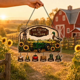Decorative sign with farm-themed design and sunset over a barn in the background
