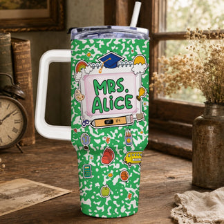 Green travel tumbler with a white handle, lid, and straw. It features a school-themed design with 'MRS. ALICE' and various colorful illustrations.