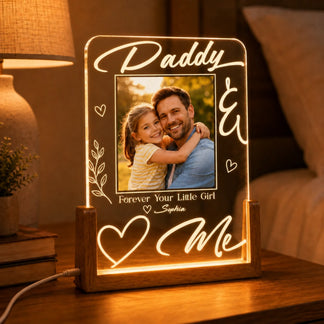 Personalized LED photo frame with a father and daughter photo, text 'Daddy & Me', on a wooden base.