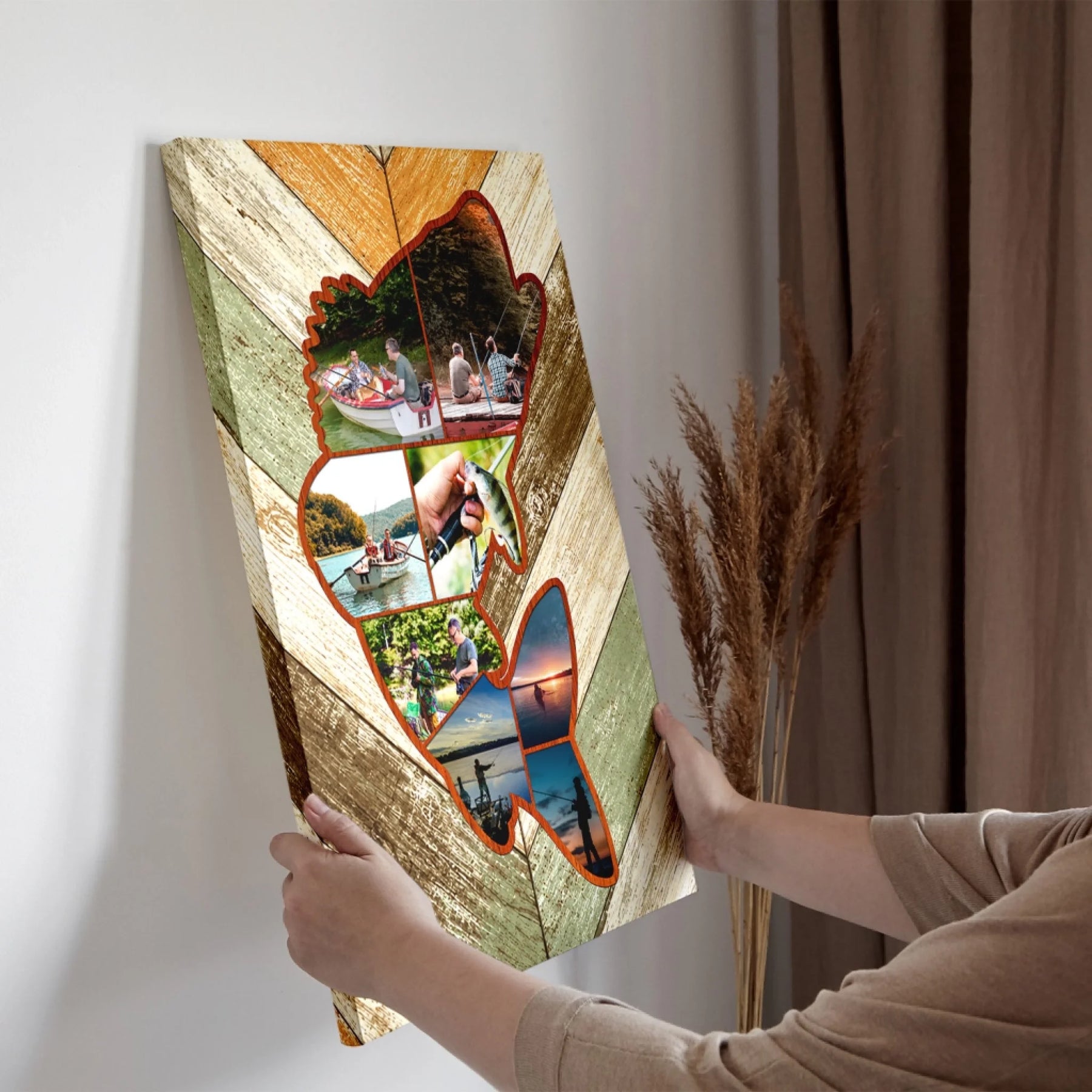Person holding a decorative wall art piece with cut-out sections.