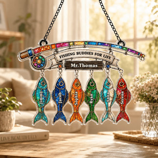 Decorative plaque with colorful fish-shaped names and 'Fishing Buddies for Life' text on a table.