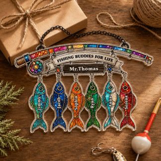 Personalized fishing-themed keychain with colorful fish designs on a wooden surface.