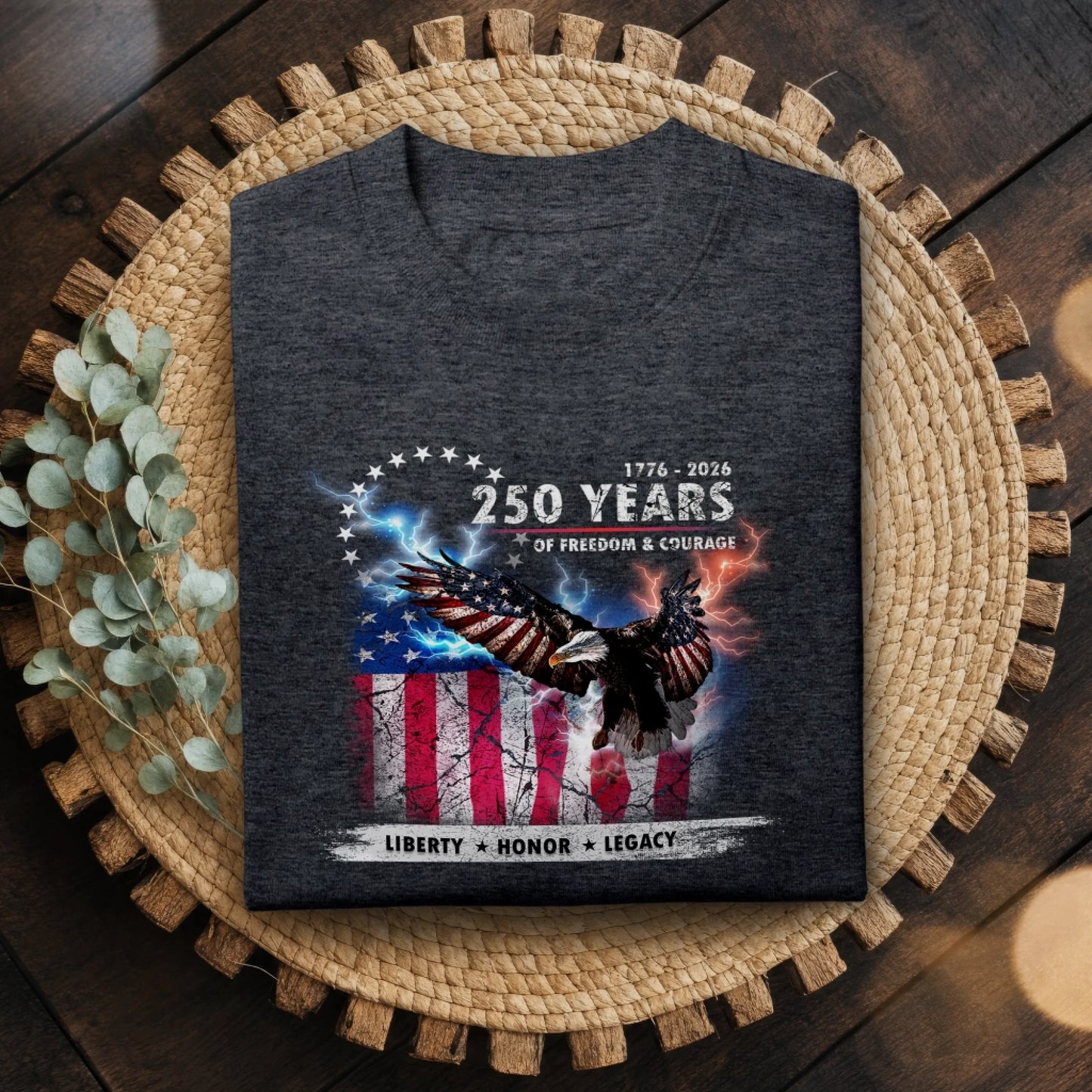 Dark gray t-shirt with eagle and American flag design on a woven mat