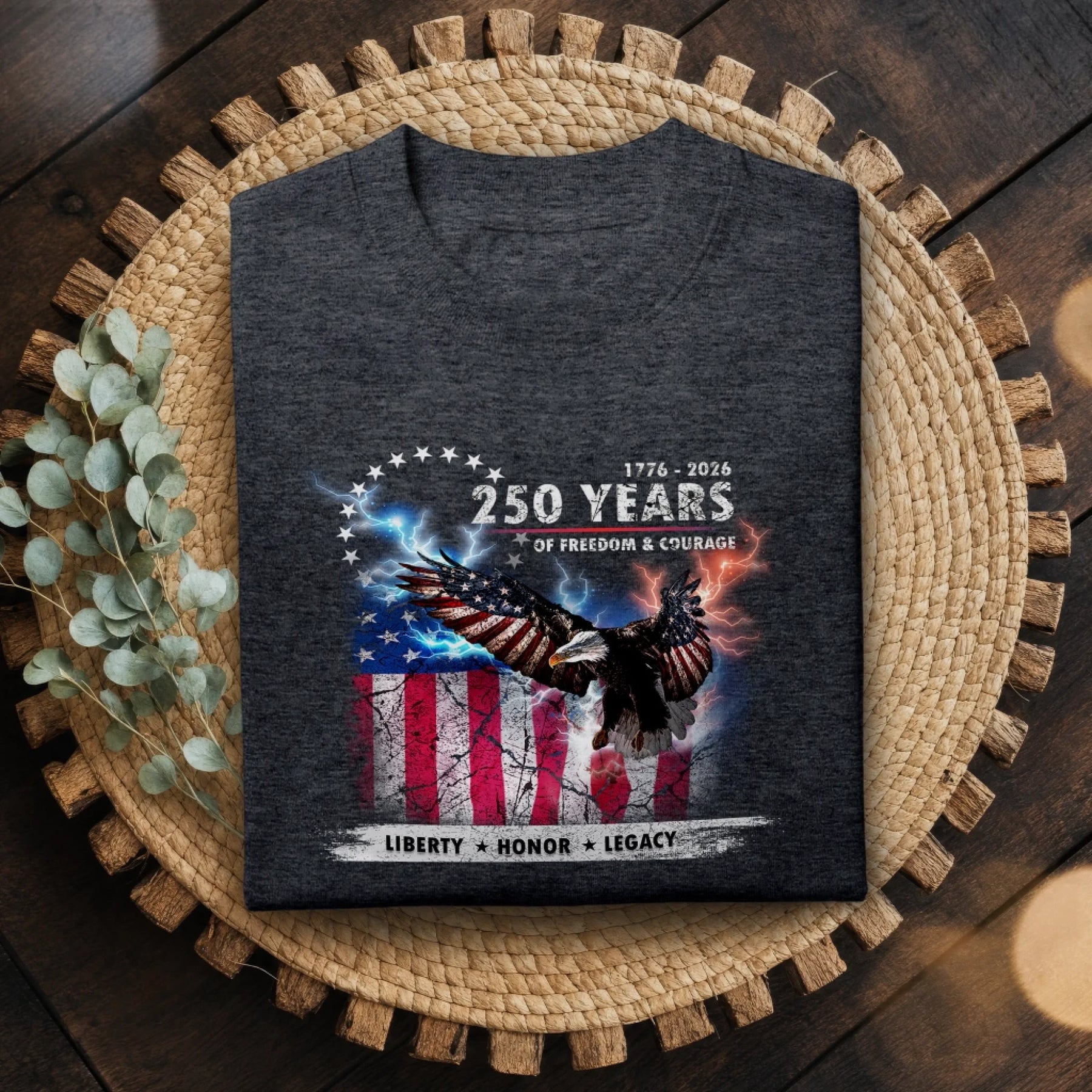 Dark gray t-shirt with eagle and American flag design on a woven mat