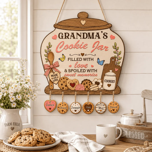 Decorative sign for Grandma's Cookie Jar with cookie-themed elements on a wooden surface.
