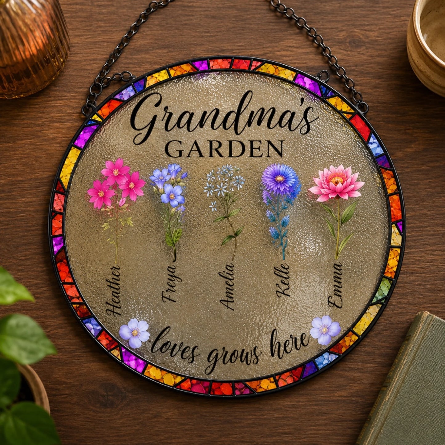 Decorative round sign with floral designs and text on a wooden surface