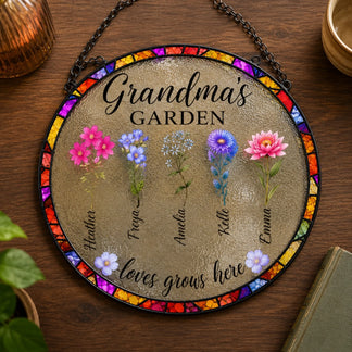 Decorative round sign with floral designs and text on a wooden surface