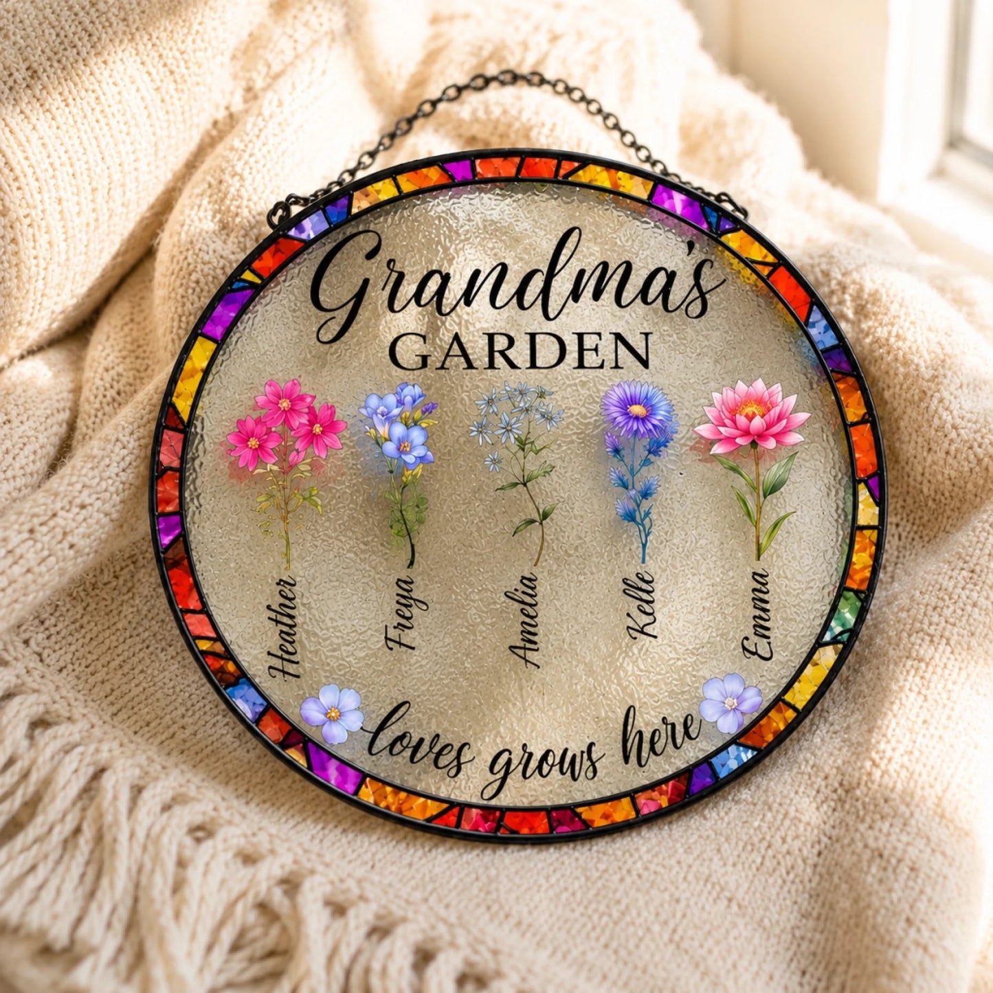 Decorative round sign with floral designs and text on a textured fabric background