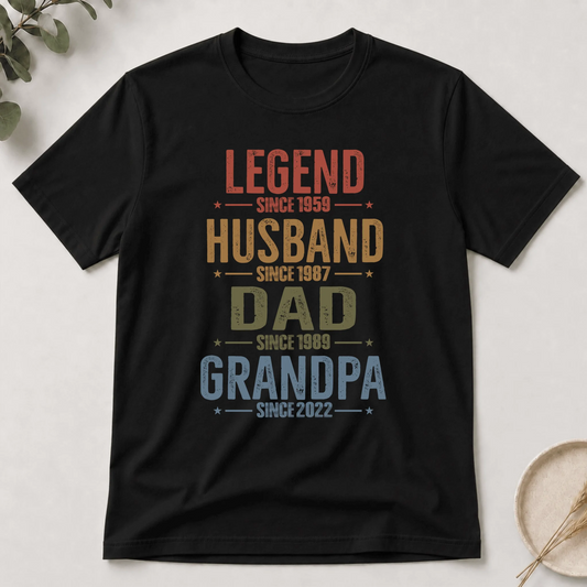 Black t-shirt with colorful text design on a light background