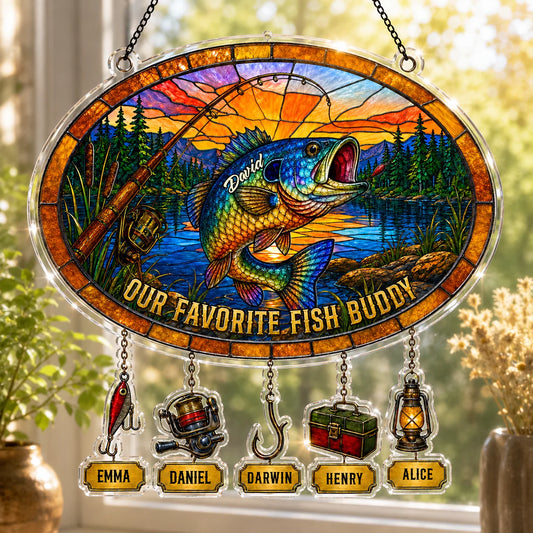 Stained glass panel with fish and personalized names, hanging indoors.