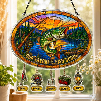 Decorative stained glass panel with fish and personalized names, hanging by a window.