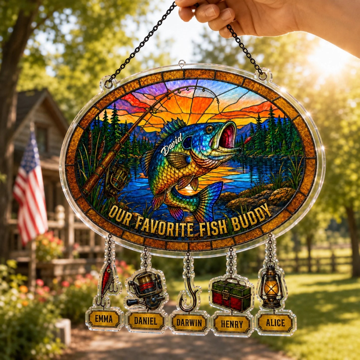 Stained glass panel with fish design and personalized names outdoors