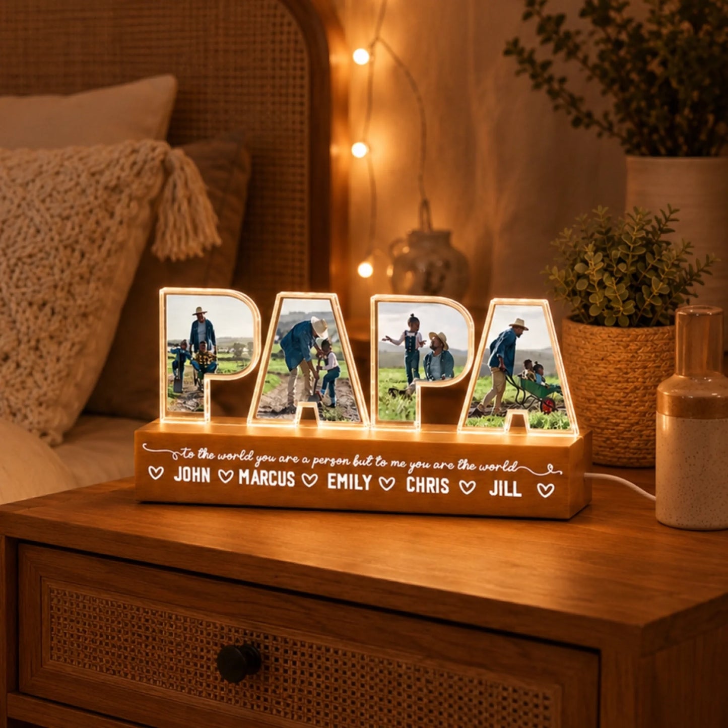 Personalized 'PAPA' lamp with photos on a wooden surface in a cozy room.