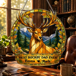 Stained glass deer artwork with 'Best Buckin' Dad Ever' text on a wooden desk.
