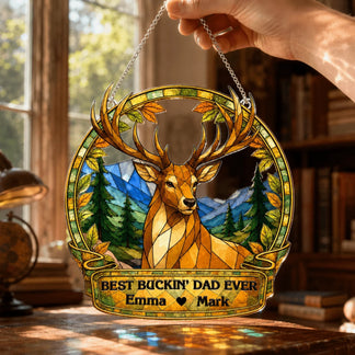 Stained glass deer ornament with 'Best Buckin' Dad Ever' text held by a hand.