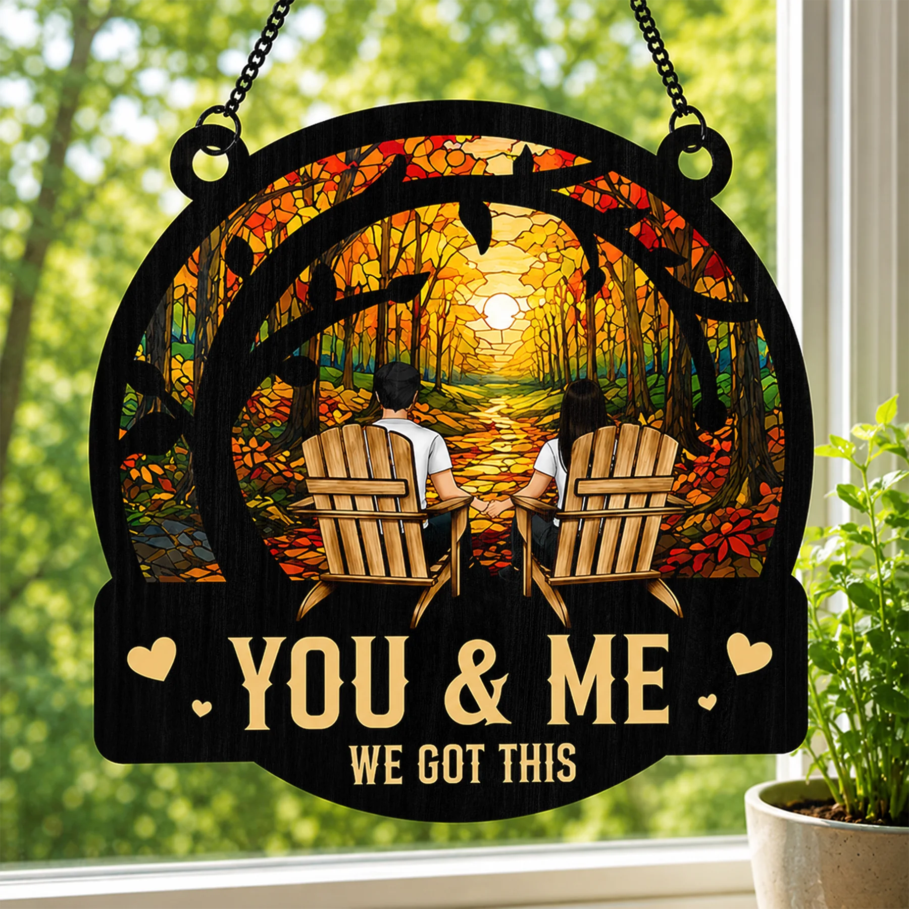 Decorative sign with 'You & Me, We Got This' text in an autumn forest setting.