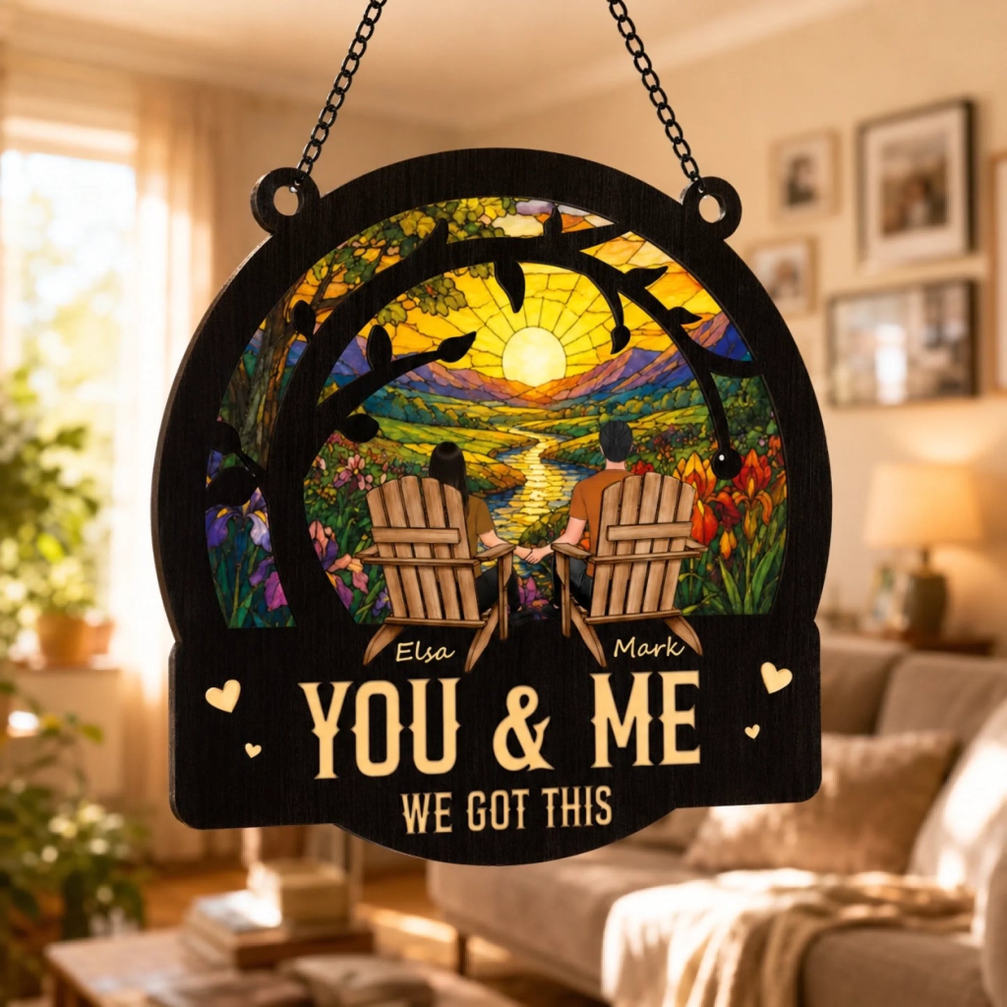 Decorative wall hanging with 'You & Me, We Got This' text in a living room setting.