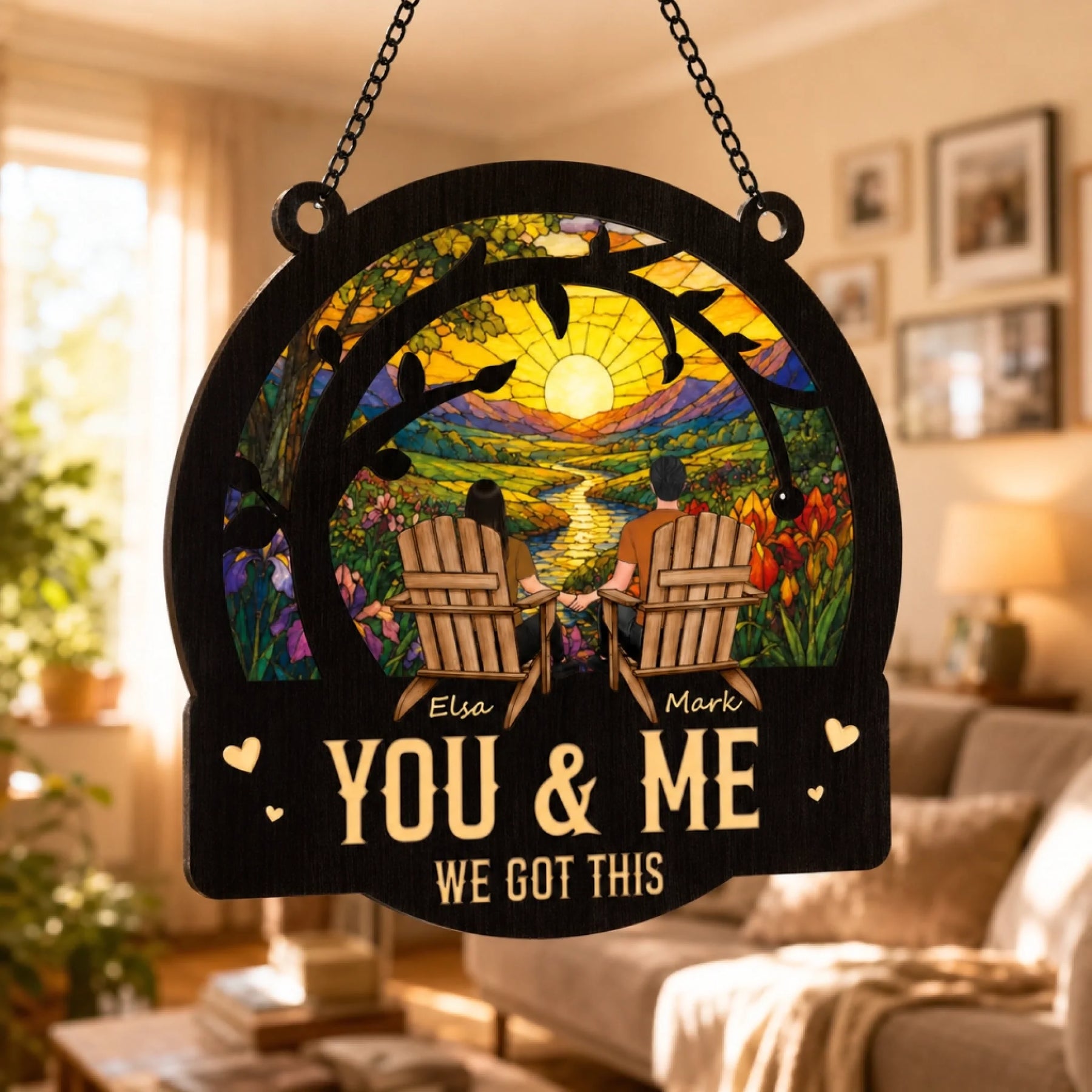 Decorative wall hanging with 'You & Me, We Got This' text in a living room setting.